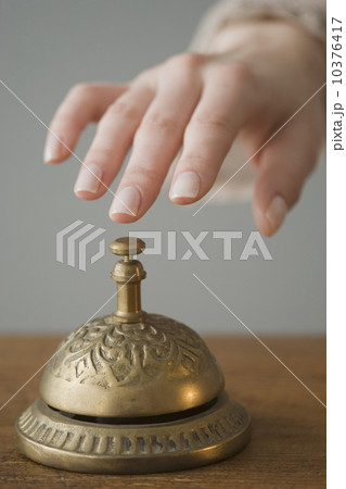 Woman ringing service bell 10376417
