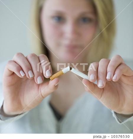 Woman breaking cigarette Woman breaking cigarette 10376530