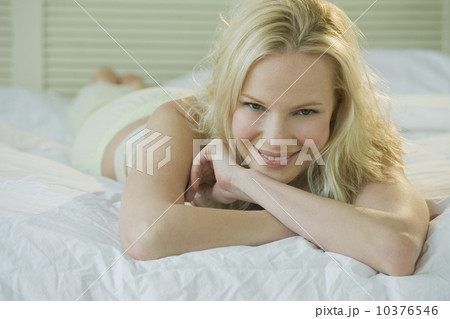 Woman relaxing on bed 10376546