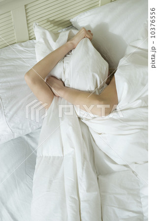 Woman sleeping in bed 10376556