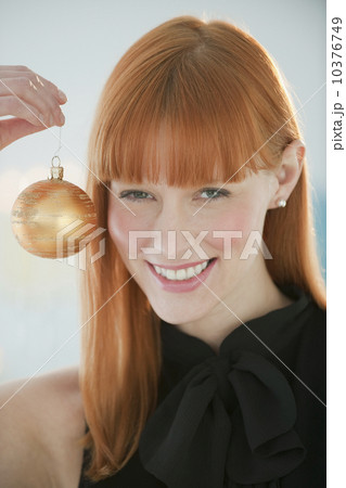 Woman holding Christmas ornament 10376749