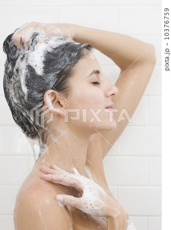 Woman washing hair in shower 10376759