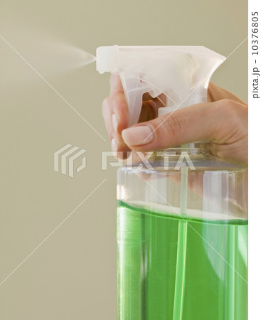 Close up of hand and spray bottle 10376805