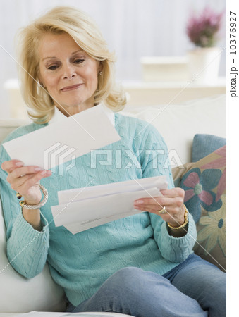 Senior woman reading mail 10376927