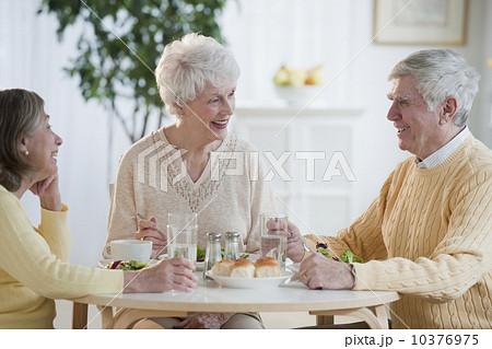 Senior adults eating dinner Senior adults eating dinner 10376975