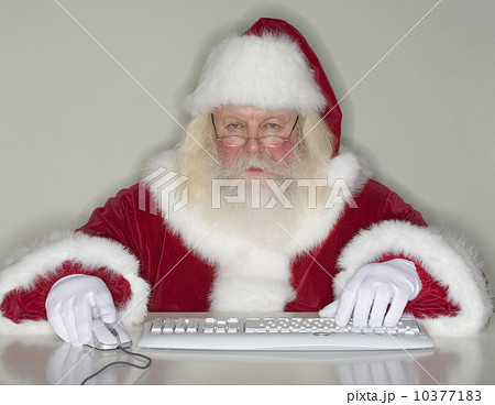 Santa Claus typing on computer 10377183