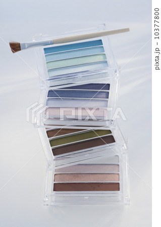 Close up of assorted cosmetics and brush 10377800