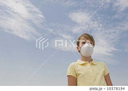 Girl wearing dust mask Girl wearing dust mask 10378194