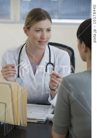 Female doctor consulting female patient 10378440