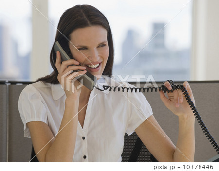 Businesswoman talking on telephone 10378446