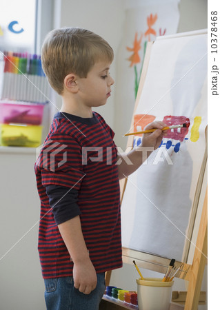 Boy painting on easel Boy painting on easel 10378468