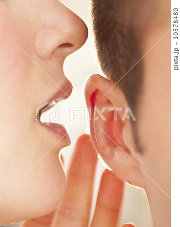 Whispering into ear Whispering into ear 10378480