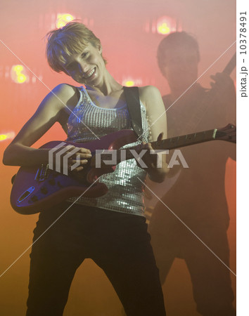 Performers playing electric guitars Performers playing electric guitars 10378491