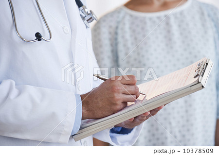 Doctor studying patient chart Doctor studying patient chart 10378509