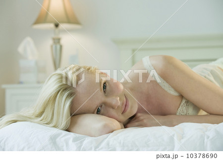 Woman relaxing on bed Woman relaxing on bed 10378690