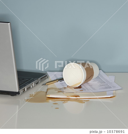 Spilled coffee on office paperwork 10378691