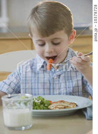 Boy eating dinner 10378728