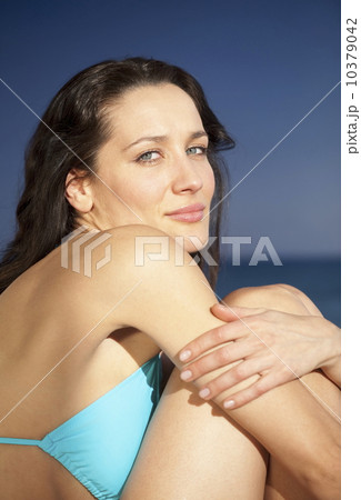 Portrait of woman in bikini at beach 10379042