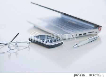 Cell phone and laptop on desk Cell phone and laptop on desk 10379120