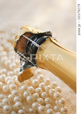 Champagne bottle and pearl necklace 10379279
