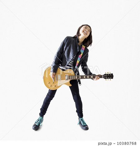 ベースギターを弾く女の子の写真素材
