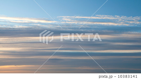 Stripes of windy clouds. Morning sky texture 10383141
