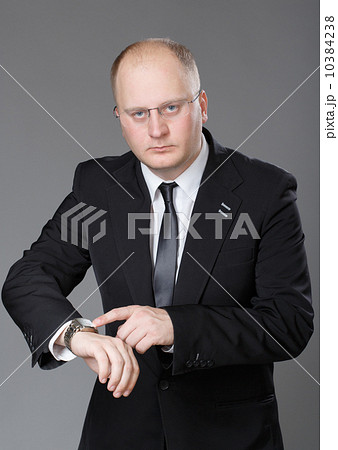 Businessman look his watch Businessman look his watch 10384238