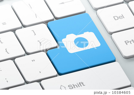 Travel concept: Photo Camera on computer keyboard background 10384605