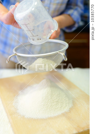 Sifting the flour Sifting the flour 10385770