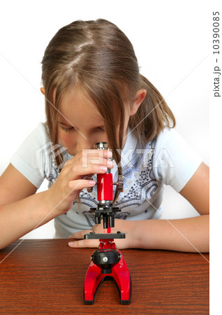 Girl studying something with microscope 10390085