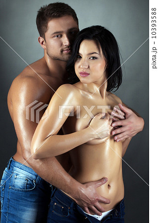 Beautiful tanned partners looking at camera 10393588