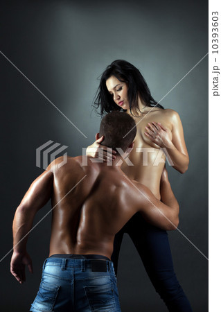 Sexy tanned oiled partners flirt with each other 10393603