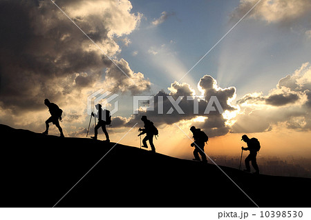 climbers on the sunset background 10398530