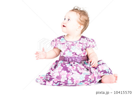 Beautiful little girl in a purple dress, isolated on white 10415570