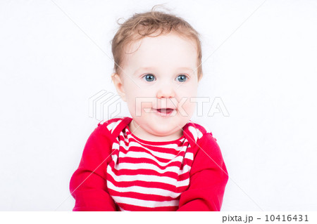 Funny little baby in a red shirt 10416431