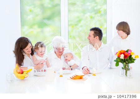Happy young family with three children - teenager boy, toddler g Happy young family with three children - teenager boy, toddler g 10417396