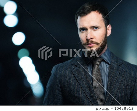Handsome well-dressed man in jacket with beard and mustache 10429913