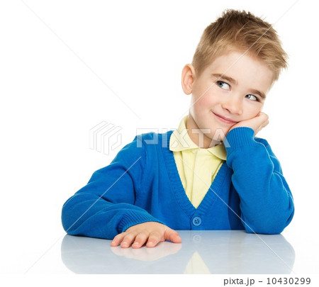 Dreaming little boy in blue cardigan and yellow shirt Dreaming little boy in blue cardigan and yellow shirt 10430299