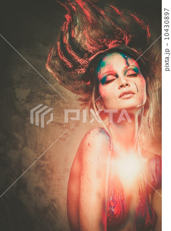 Young woman muse with creative body art and hairdo 10430897