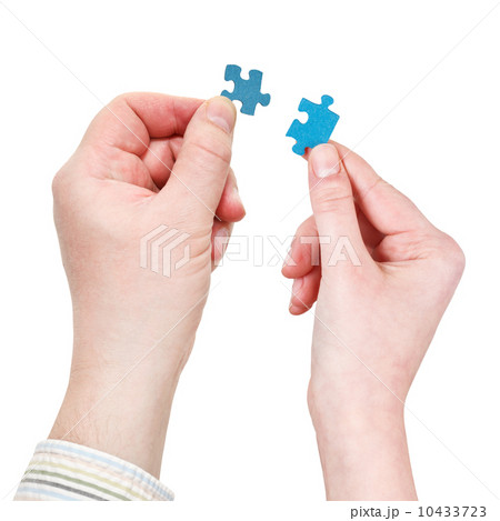 male and female hands with little puzzle pieces male and female hands with little puzzle pieces 10433723