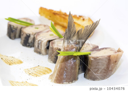 appetizer of herring stuffing on a table in a restaurant appetizer of herring stuffing on a table in a restaurant 10434076