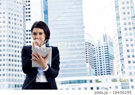 Business woman with tablet contemplating Business woman with tablet contemplating 10436295