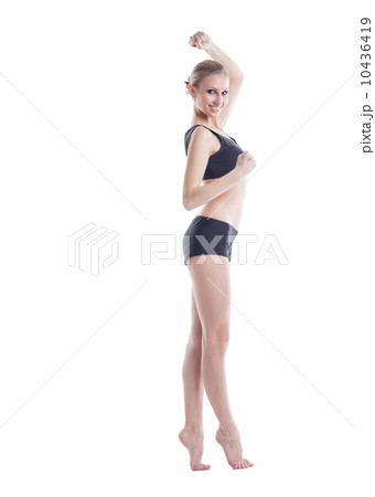 Cheerful slim girl posing looking at camera Cheerful slim girl posing looking at camera 10436419