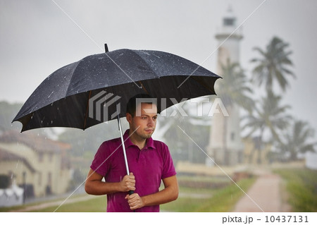 Man in heavy rain Man in heavy rain 10437131