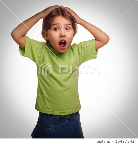 gray Teen scared girl child opened her mouth feels fear and horr gray Teen scared girl child opened her mouth feels fear and horr 10437542