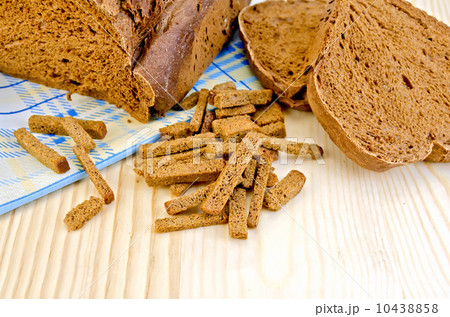 Rye homemade bread on board with crackers Rye homemade bread on board with crackers 10438858
