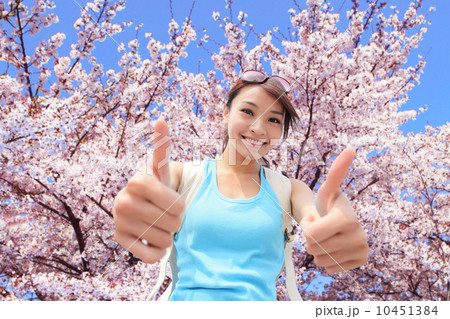 Happy woman traveler show thumb up Happy woman traveler show thumb up 10451384