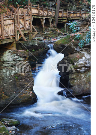 Autumn creek with hiking trail and rocks 10453179