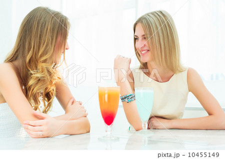 two beautiful women chatting in a cafe 10455149