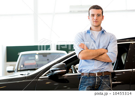 man standing near a car man standing near a car 10455314